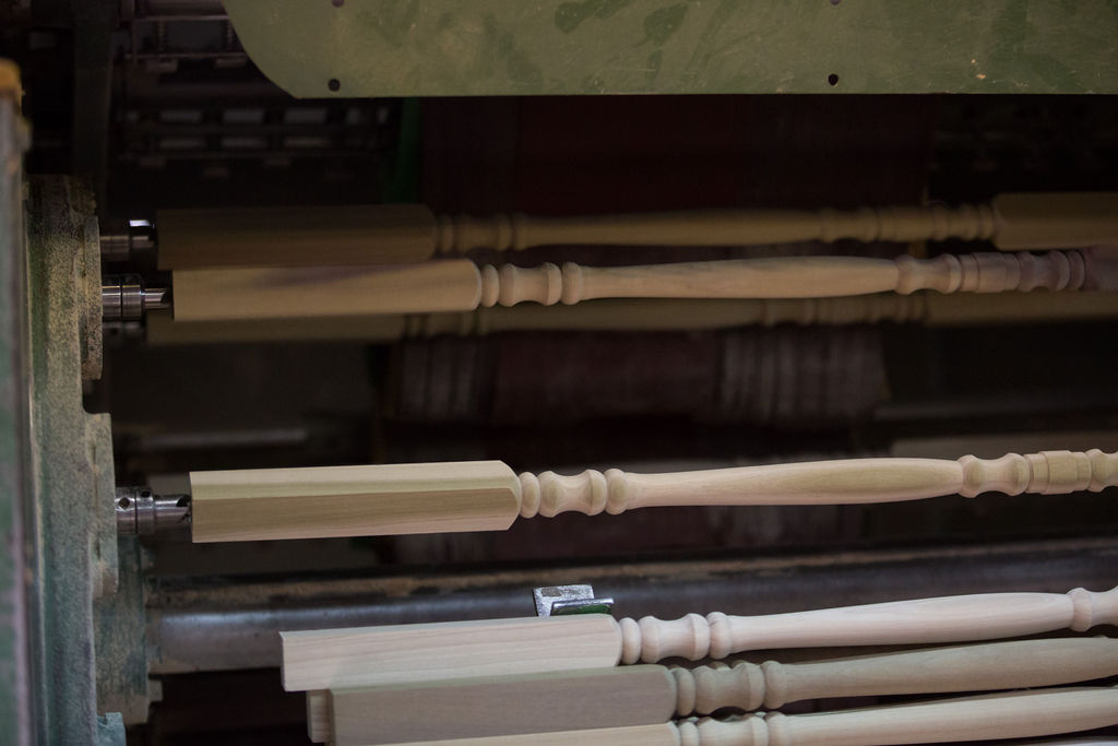 Spindles being turned in a row on an automatic Mattison lathe