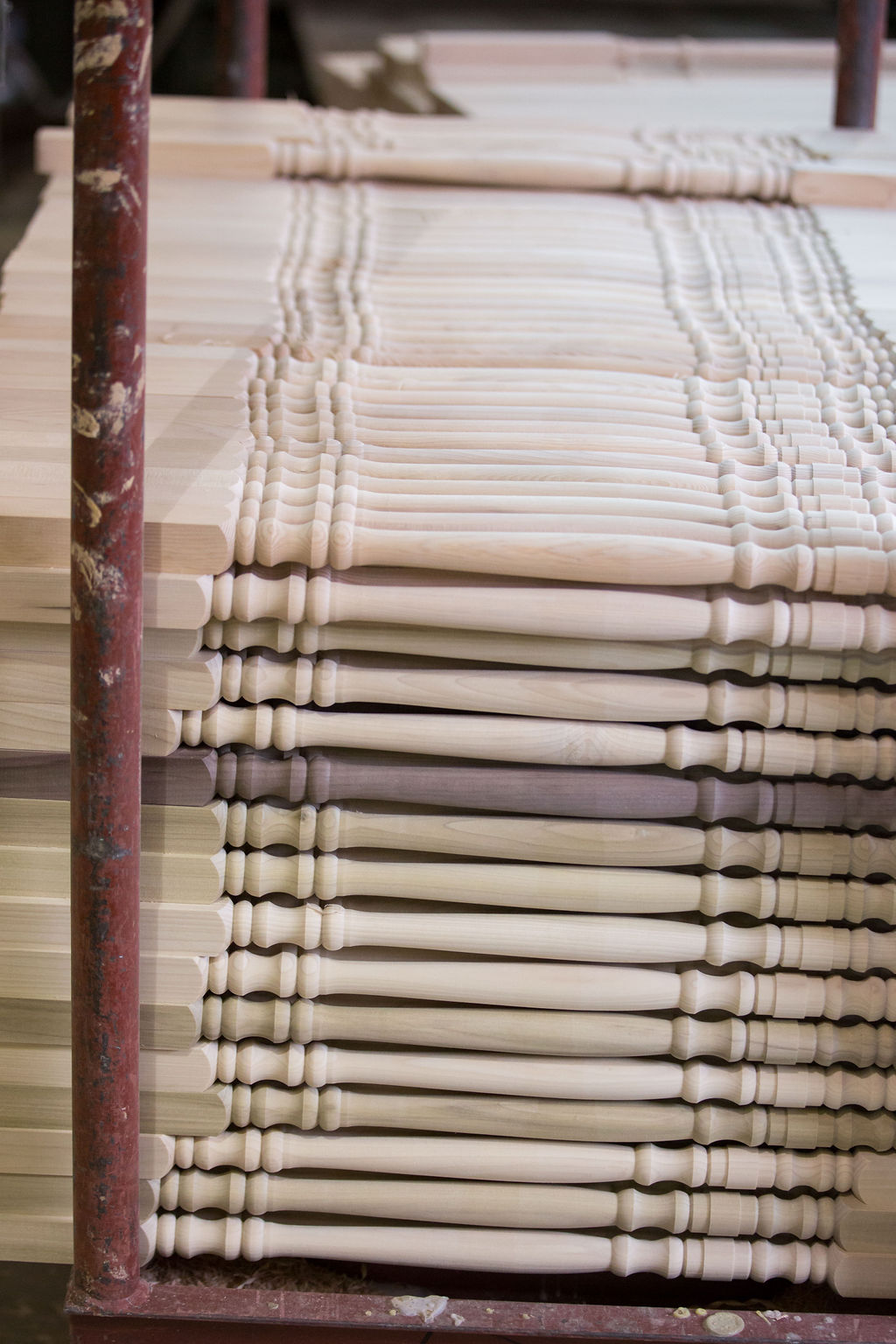 Finished turned spindles stacked in the shop